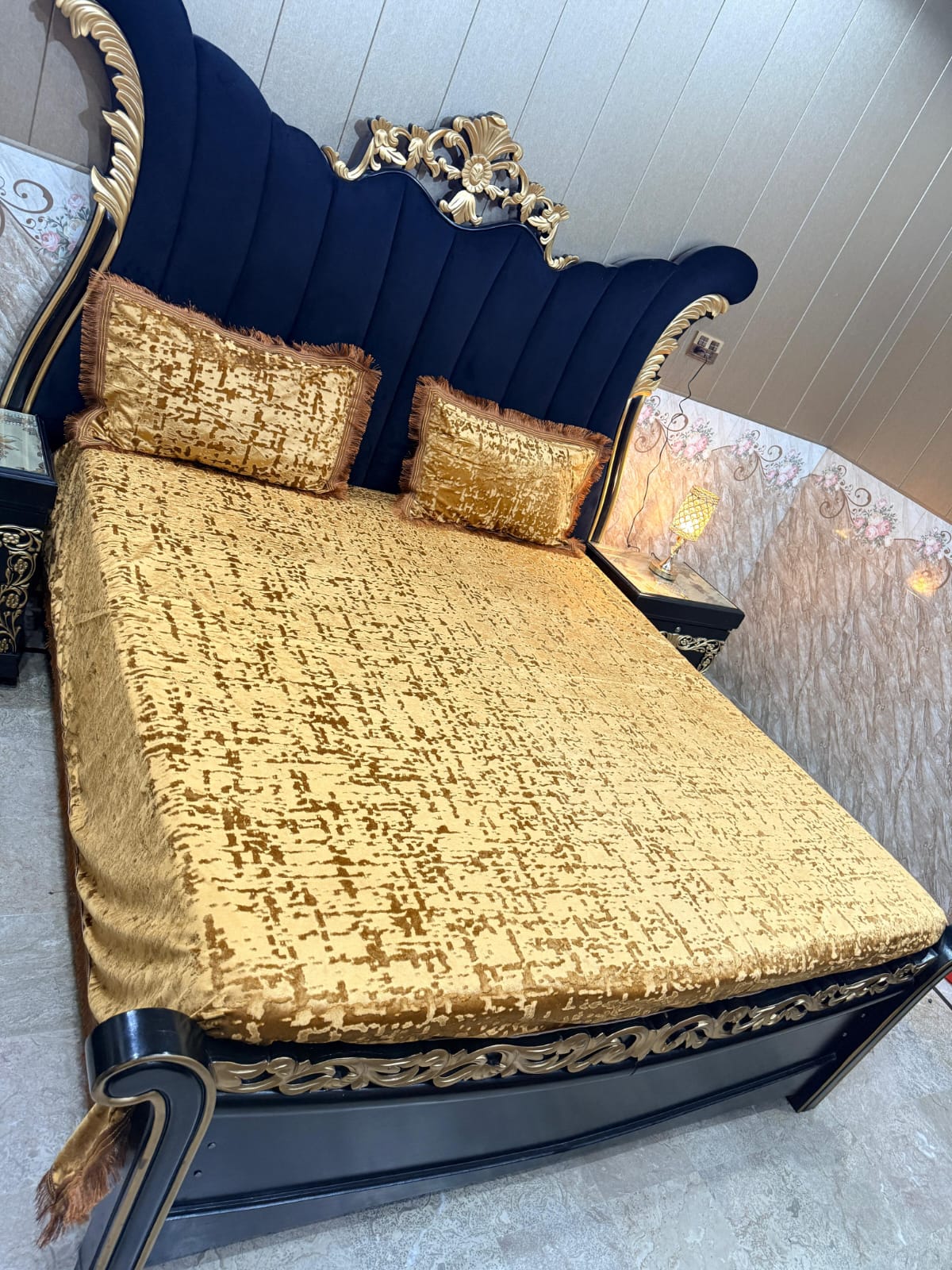 Velvet bedsheet from Al Ghani O Nisar with intricate design, showcasing luxurious fabric and vibrant colors.