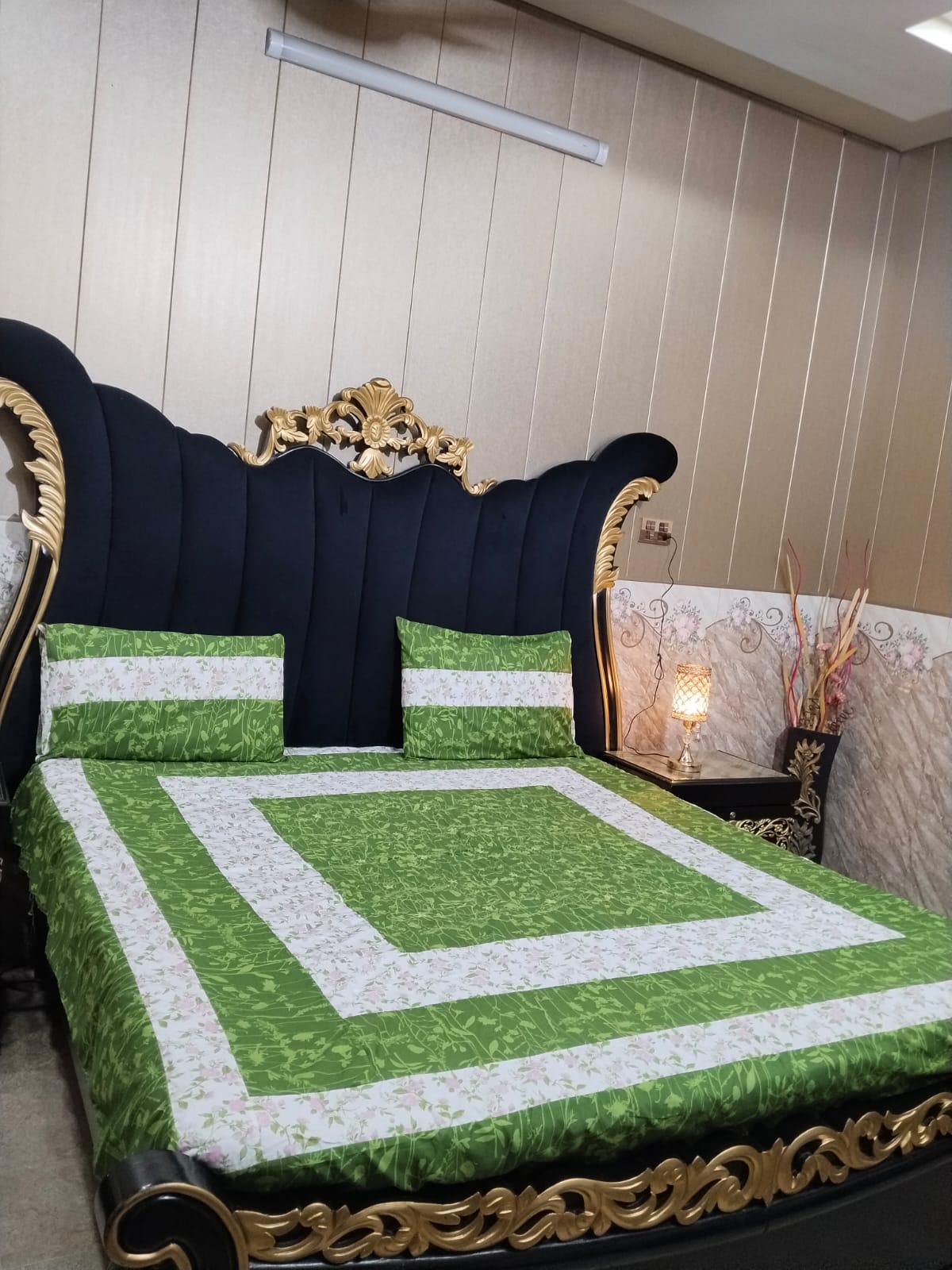 Colorful embroidered patchwork bedsheet by Al Ghani O Nisar featuring intricate patterns and vibrant fabric details.