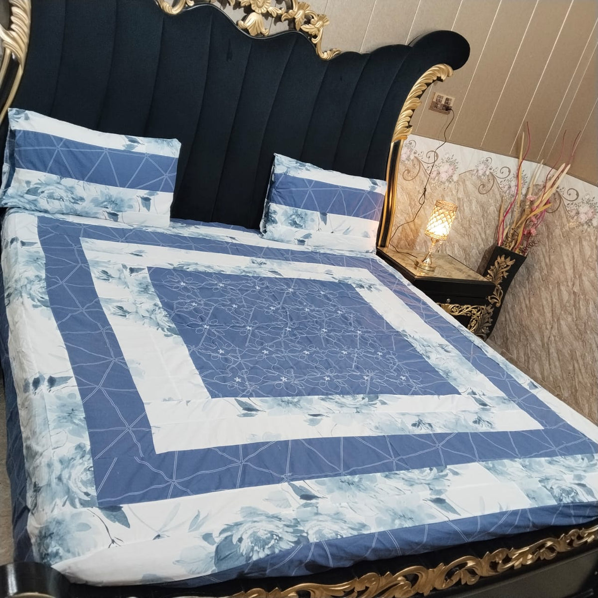Colorful embroidered patchwork bedsheet by Al Ghani O Nisar featuring intricate designs and vibrant fabric details.