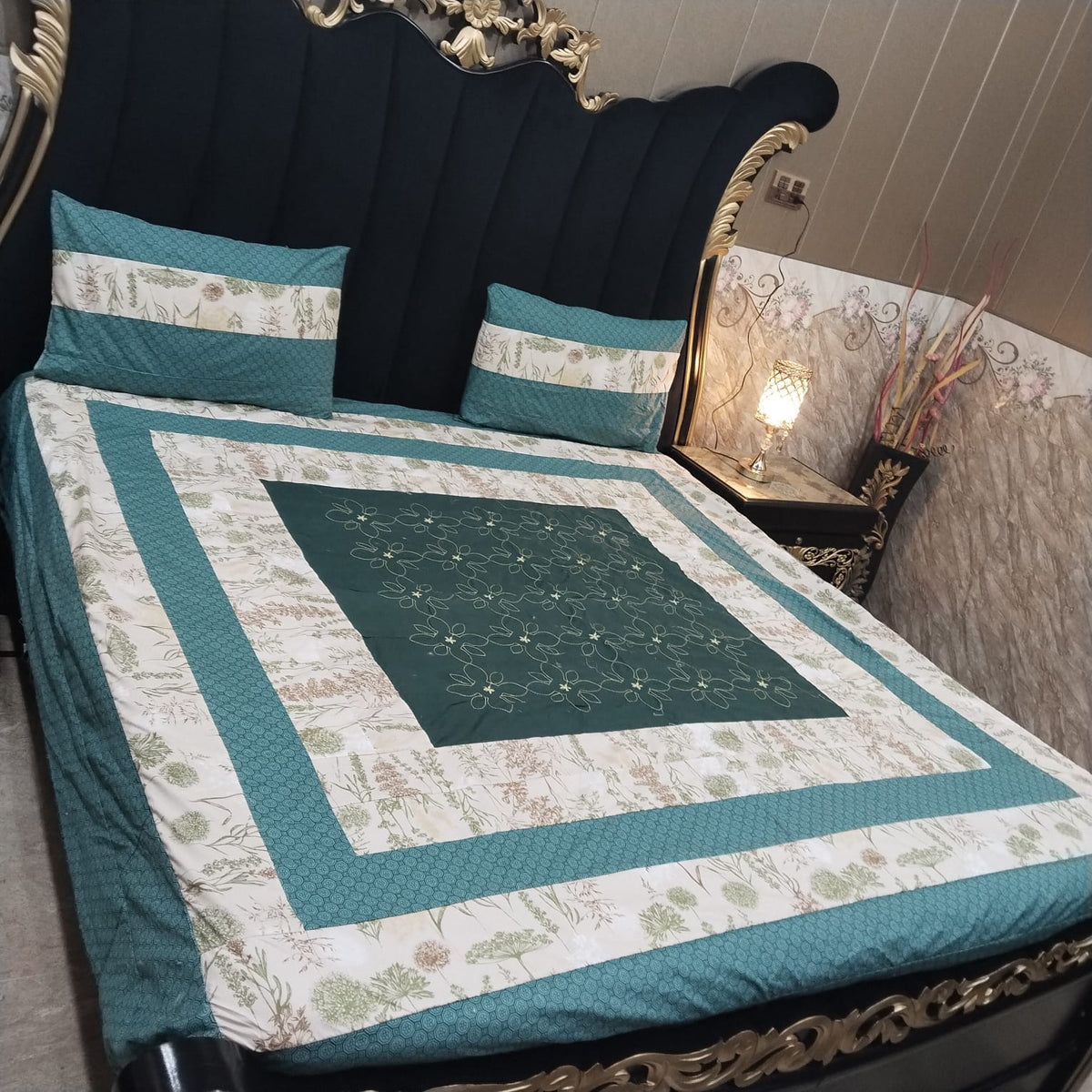 Colorful embroidered patchwork bedsheet by Al Ghani O Nisar featuring intricate designs and vibrant fabric details.