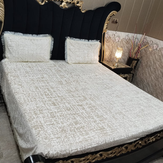 Velvet bedsheet from Barfi collection by Al Ghani O Nisar, featuring soft fabric with intricate patterns and rich red color.