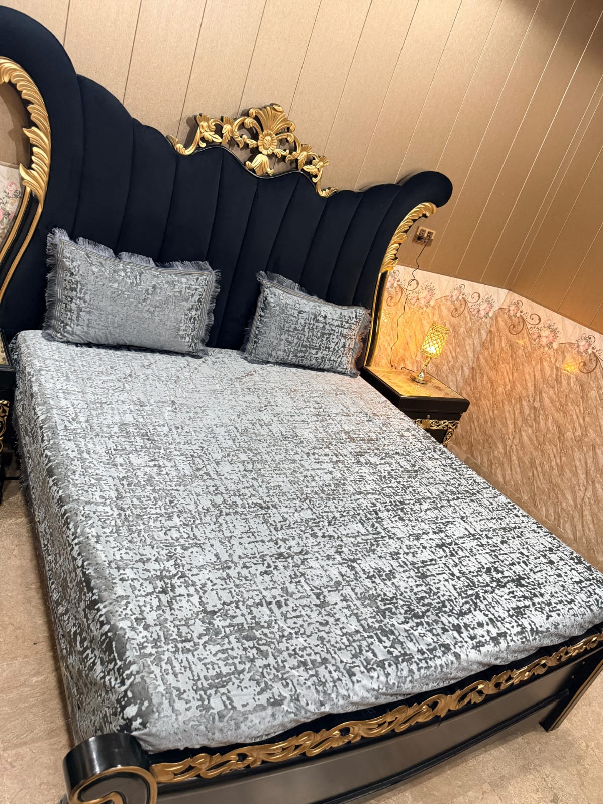 Al Ghani O Nisar Barfi Velvet bedsheet with intricate floral patterns in vibrant colors displayed on a bed.