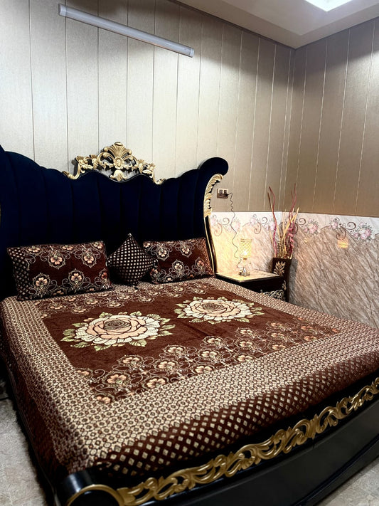 Al Ghani O Nisar Jovial Jacquard bedsheet with intricate woven patterns in vibrant colors, shown draped on a bed.