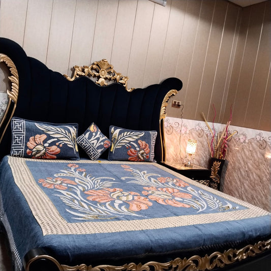 Al Ghani O Nisar Jovial Jacquard bedsheet with intricate patterns and vibrant colors, displayed on a neatly made bed.