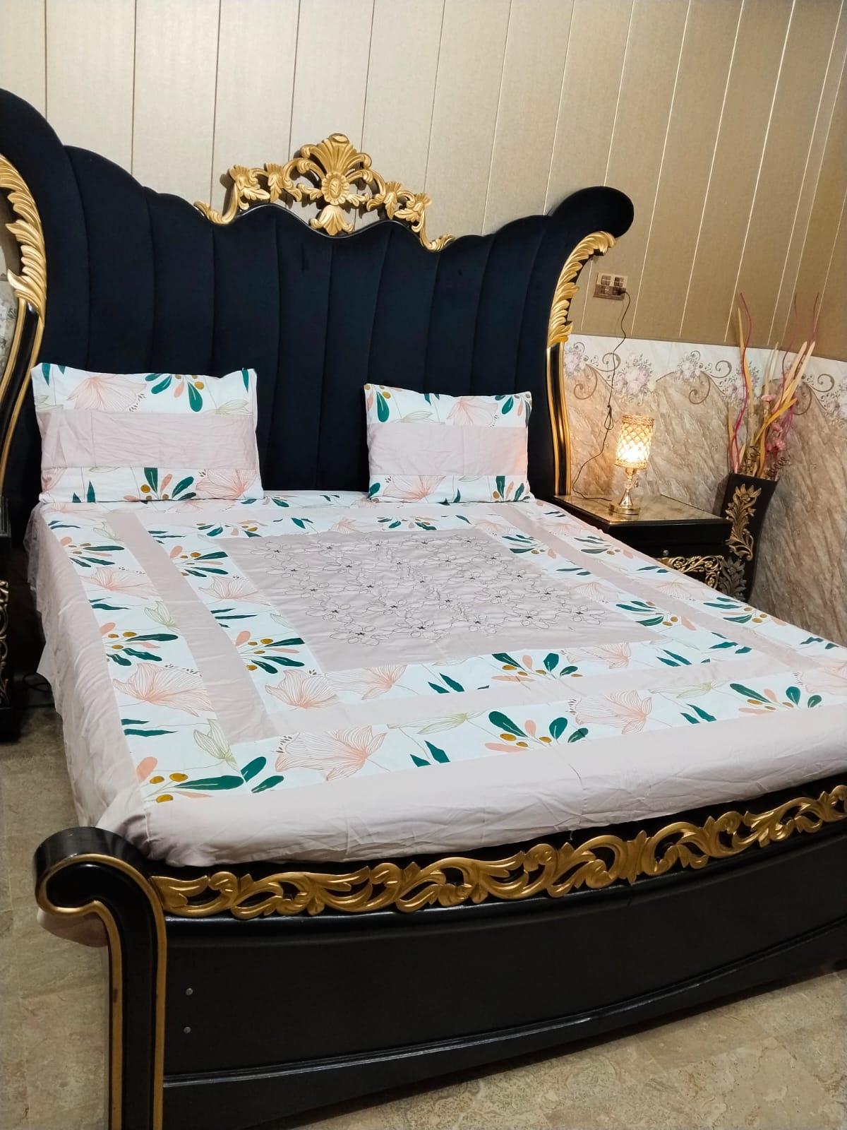 Colorful embroidered patchwork bedsheet by Al Ghani O Nisar featuring intricate stitches and vibrant fabric design.