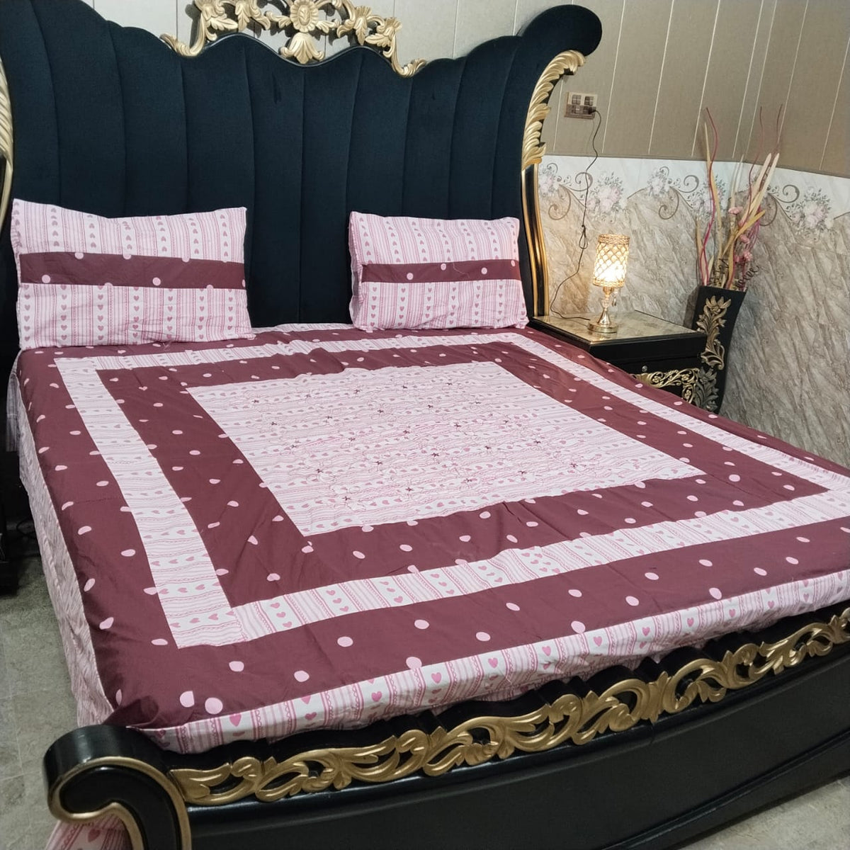Colorful embroidered patchwork bedsheet from Al Ghani O Nisar with intricate designs and vibrant patterns on soft fabric.