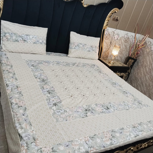 Colorful embroidered patchwork bedsheet by Al Ghani O Nisar featuring intricate designs and soft fabric for a cozy bedroom look.
