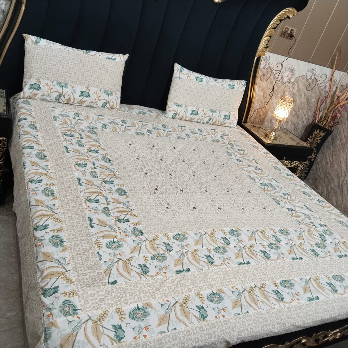 Colorful embroidered patchwork bedsheet by Al Ghani O Nisar with intricate patterns and vibrant design for a cozy bedroom decor.