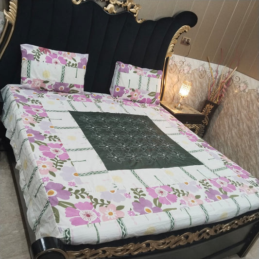 Embroidered patchwork bedsheet by Al Ghani O Nisar featuring colorful, intricate designs on soft fabric.