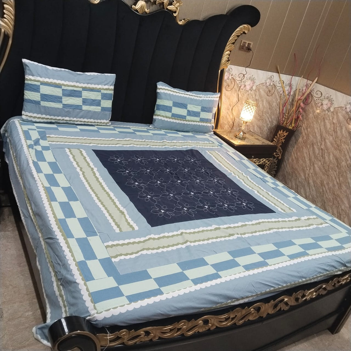 Colorful embroidered patchwork bedsheet by Al Ghani O Nisar featuring intricate design and vibrant fabric for a cozy bedroom decor.