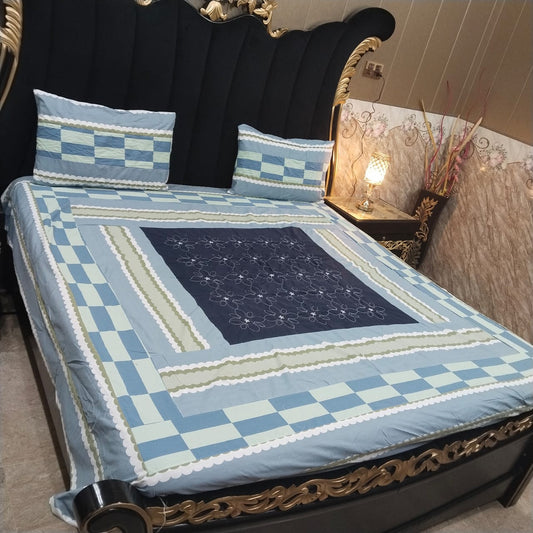 Colorful embroidered patchwork bedsheet by Al Ghani O Nisar featuring intricate design and vibrant fabric for a cozy bedroom decor.