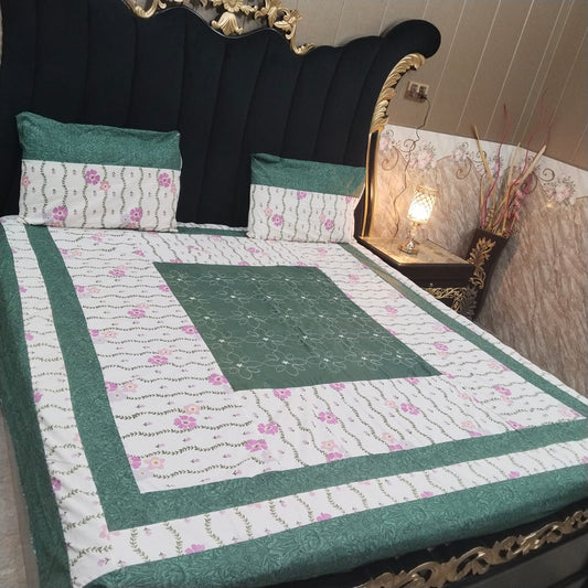 Colorful embroidered patchwork bedsheet by Al Ghani O Nisar with intricate designs and vibrant fabric for a cozy bedroom look.