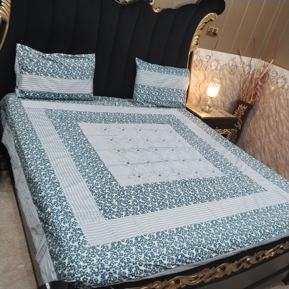Colorful embroidered patchwork bedsheet by Al Ghani O Nisar featuring intricate patterns and vibrant design for a cozy bedroom look.