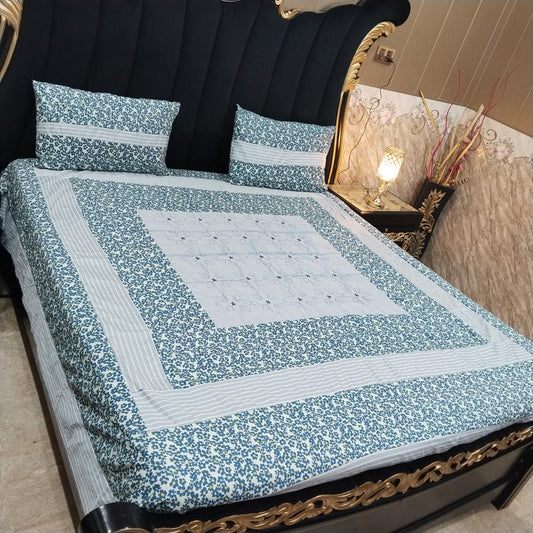 Colorful embroidered patchwork bedsheet by Al Ghani O Nisar with intricate designs and vibrant fabric for a decorative bedroom look.