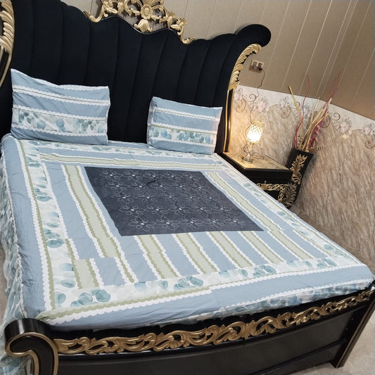 Colorful embroidered patchwork bedsheet by Al Ghani O Nisar featuring intricate patterns and vibrant design.