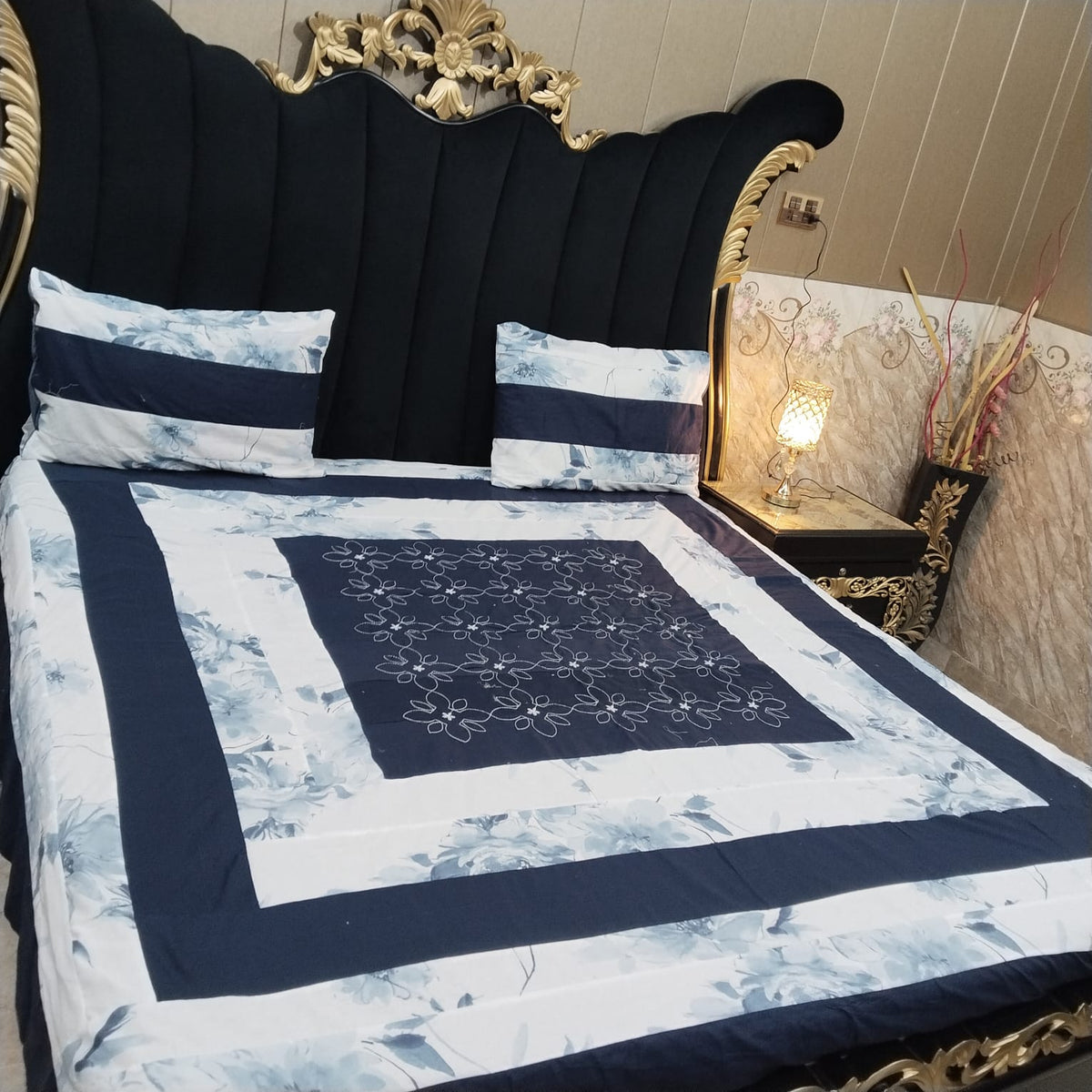 Colorful embroidered patchwork bedsheet by Al Ghani O Nisar featuring intricate patterns and vibrant fabric details.