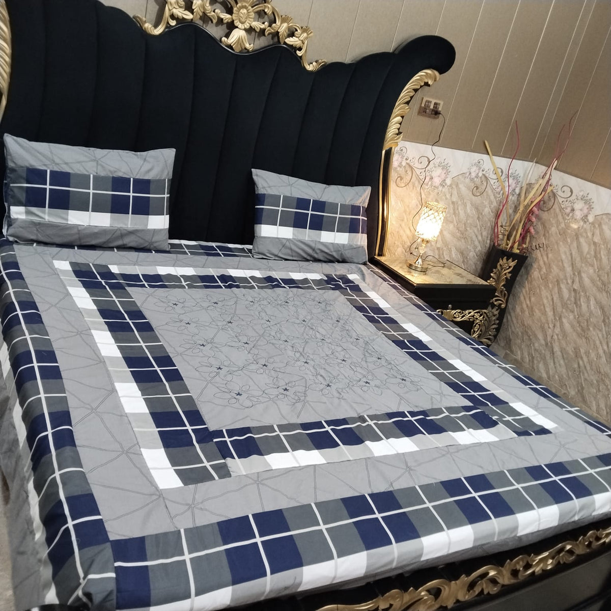 Colorful embroidered patchwork bedsheet from Al Ghani O Nisar featuring intricate stitched patterns and vibrant fabric details.