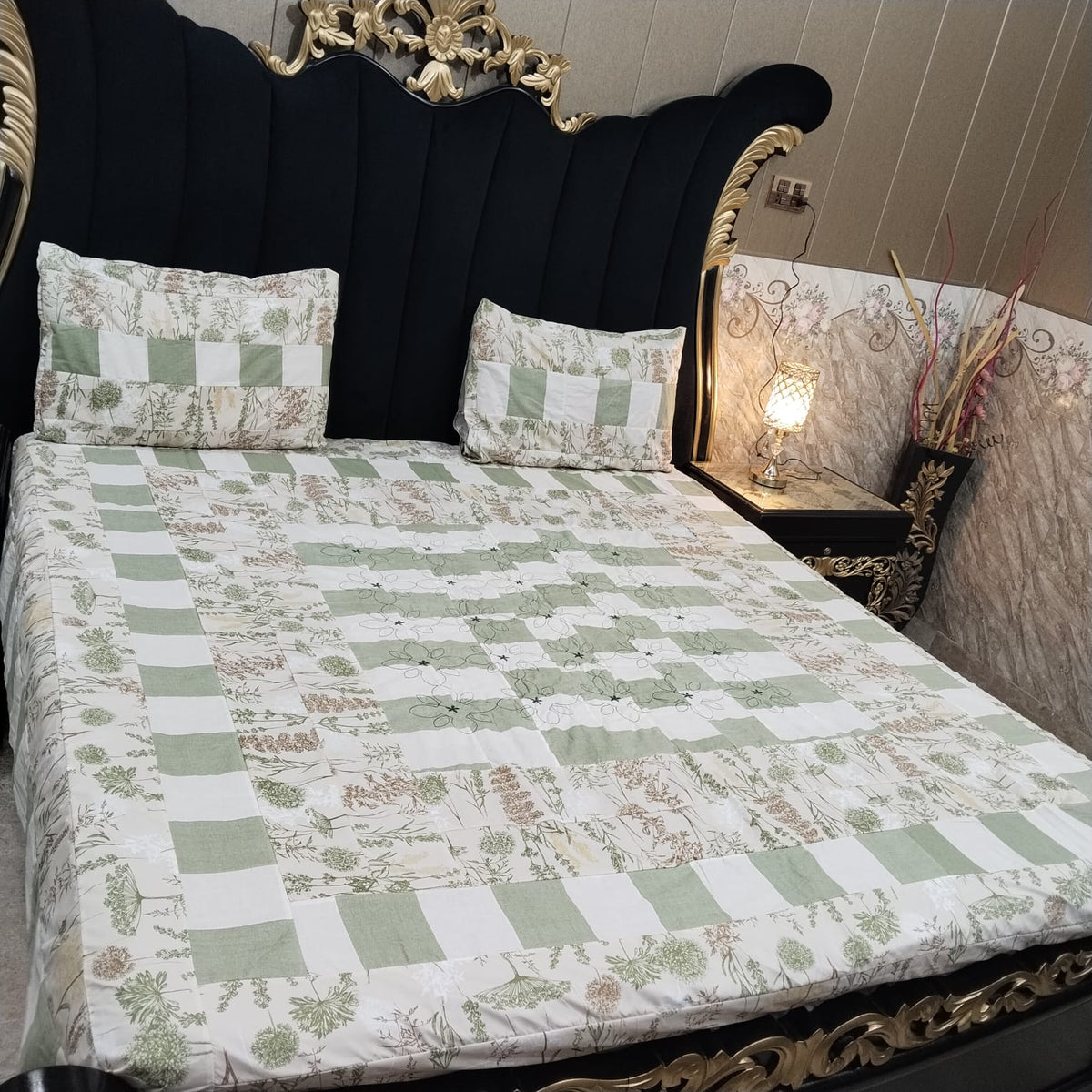 Colorful embroidered patchwork bedsheet by Al Ghani O Nisar featuring intricate designs and vibrant fabric for a cozy bedroom decor