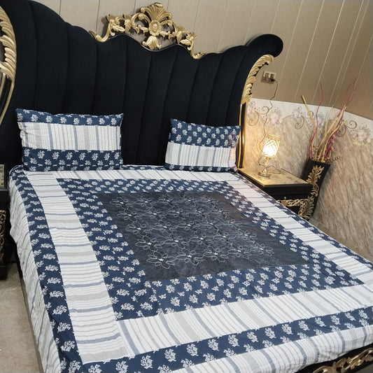 Colorful embroidered patchwork bedsheet by Al Ghani O Nisar, featuring intricate patterns and vibrant fabric details.
