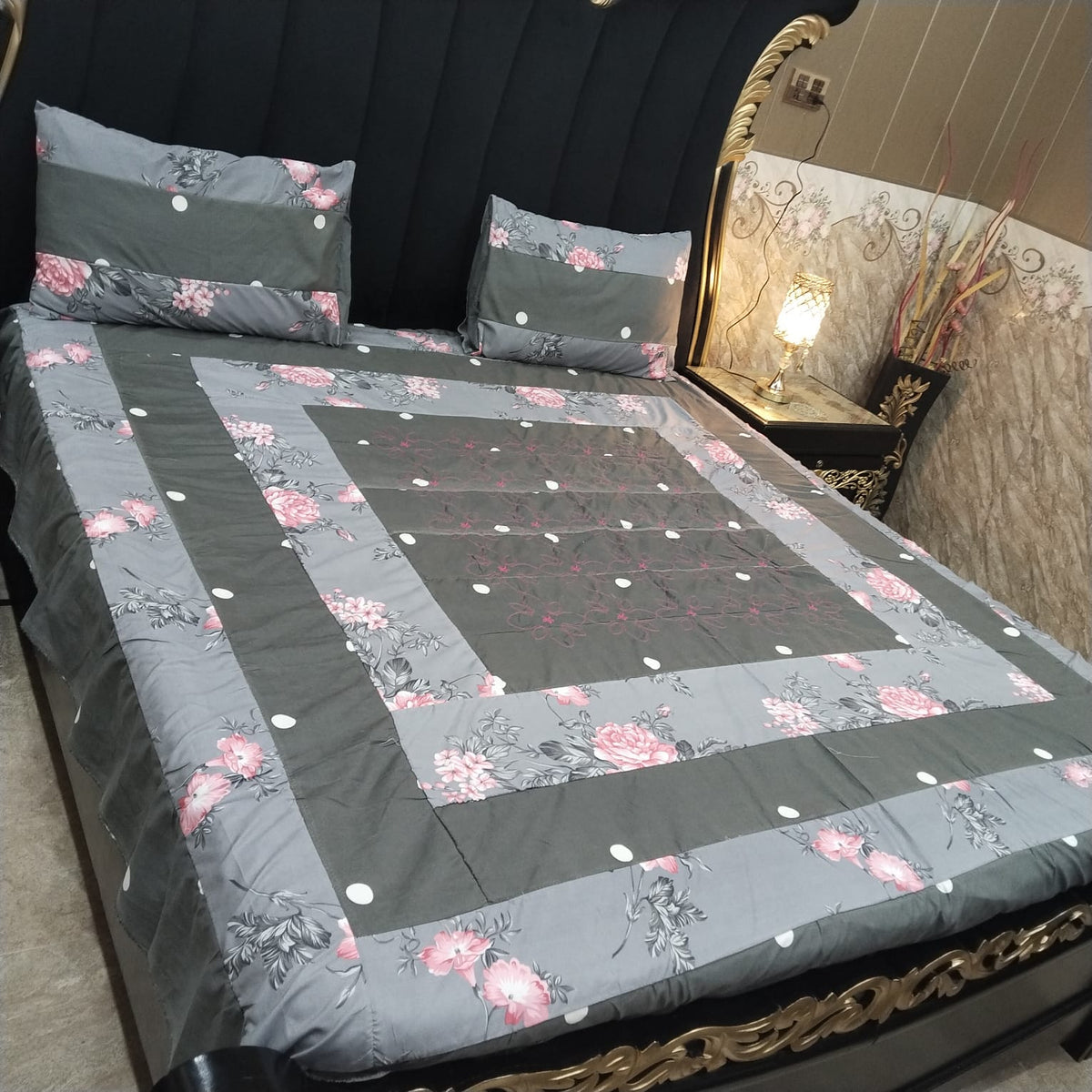 Colorful embroidered patchwork bedsheet by Al Ghani O Nisar featuring intricate designs and soft fabric for a cozy bedroom.