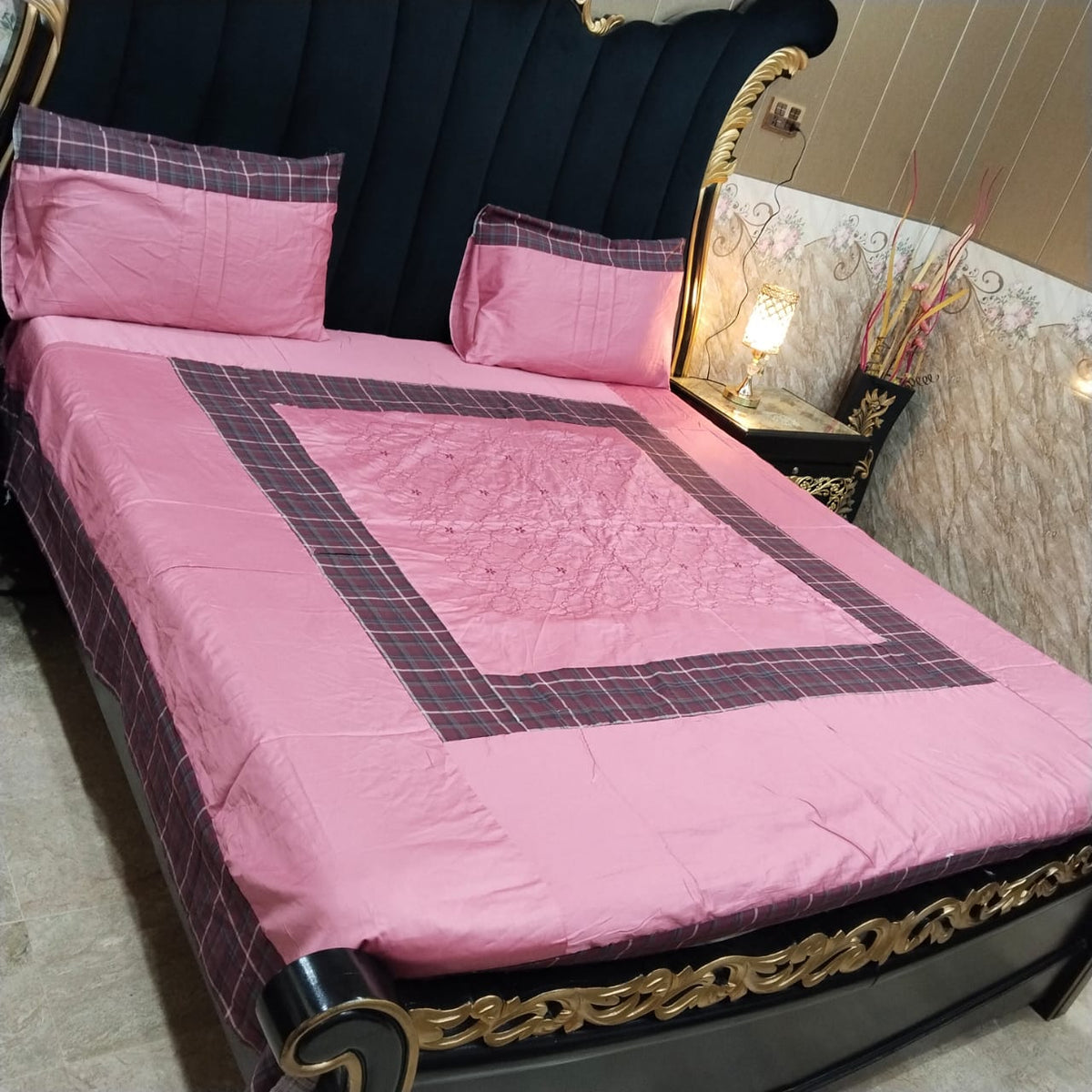 Colorful embroidered patchwork bedsheet by Al Ghani O Nisar, showcasing intricate designs and vibrant patterns.