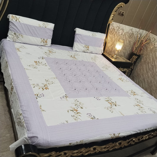 Colorful embroidered patchwork bedsheet by Al Ghani O Nisar with intricate stitching and vibrant fabric patterns.