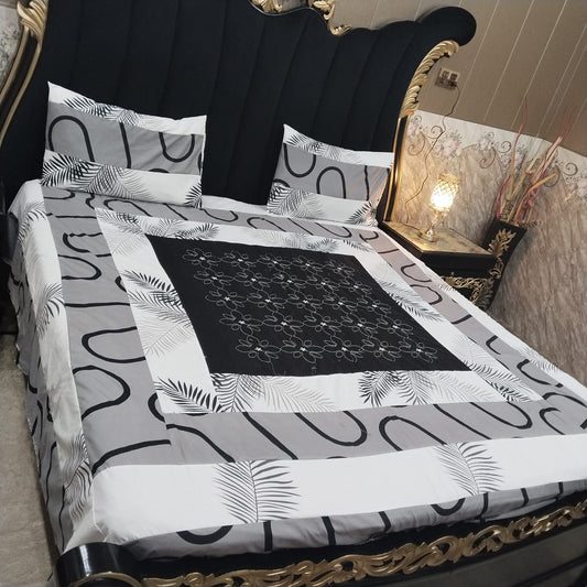 Colorful embroidered patchwork bedsheet by Al Ghani O Nisar with intricate designs and vibrant fabric for a stylish bedroom decor.
