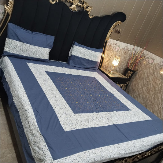 Colorful embroidered patchwork bedsheet by Al Ghani O Nisar featuring intricate patterns and vibrant fabric details.