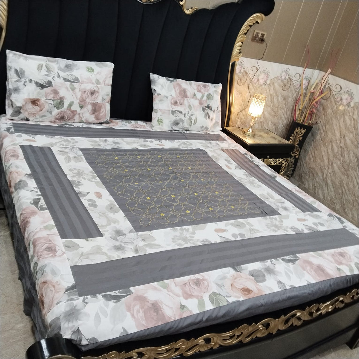 Colorful embroidered patchwork bedsheet by Al Ghani O Nisar, featuring intricate stitching and vibrant traditional patterns.
