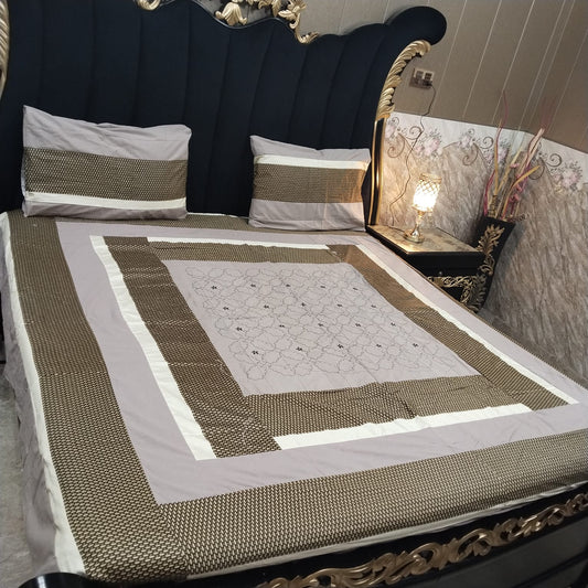 Colorful embroidered patchwork bedsheet by Al Ghani O Nisar featuring intricate patterns and vibrant fabric details.