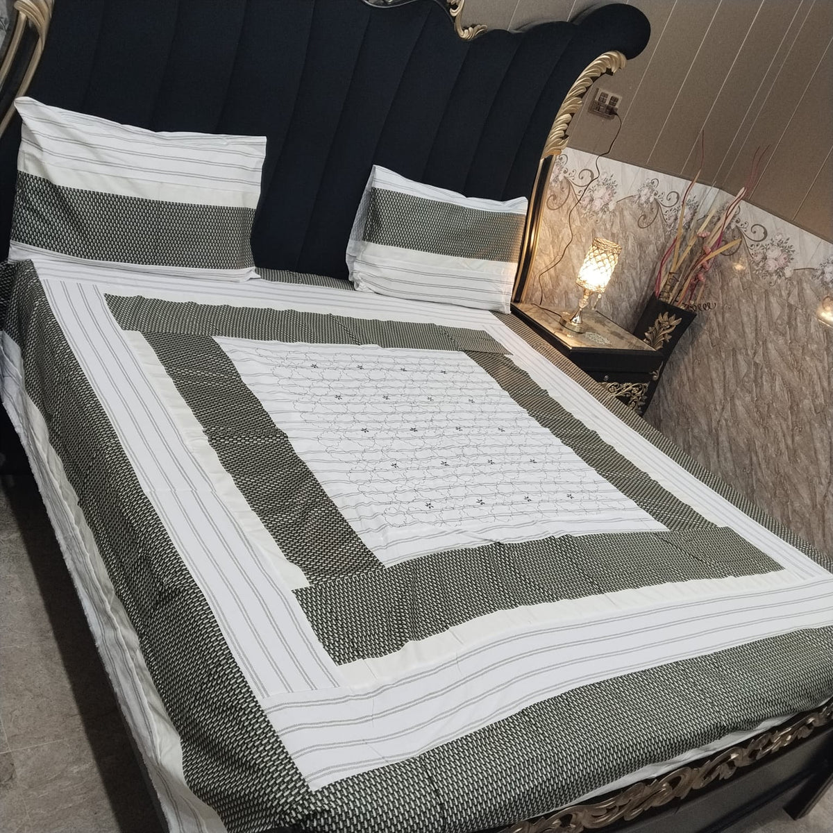 Colorful embroidered patchwork bedsheet by Al Ghani O Nisar with intricate patterns and vibrant design for a cozy bedroom decor