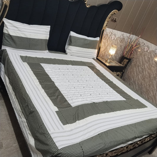 Colorful embroidered patchwork bedsheet by Al Ghani O Nisar with intricate patterns and vibrant design for a cozy bedroom decor
