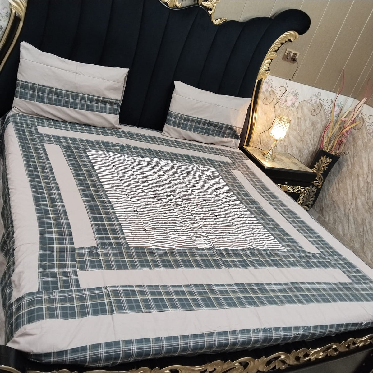 Colorful embroidered patchwork bedsheet by Al Ghani O Nisar, showcasing intricate design and vibrant fabric details.