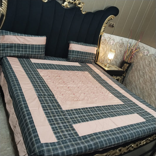 Colorful embroidered patchwork bedsheet by Al Ghani O Nisar, showcasing intricate patterns and vibrant fabric details.
