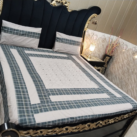 Embroidered patchwork bedsheet by Al Ghani O Nisar featuring colorful, intricate designs on soft fabric.