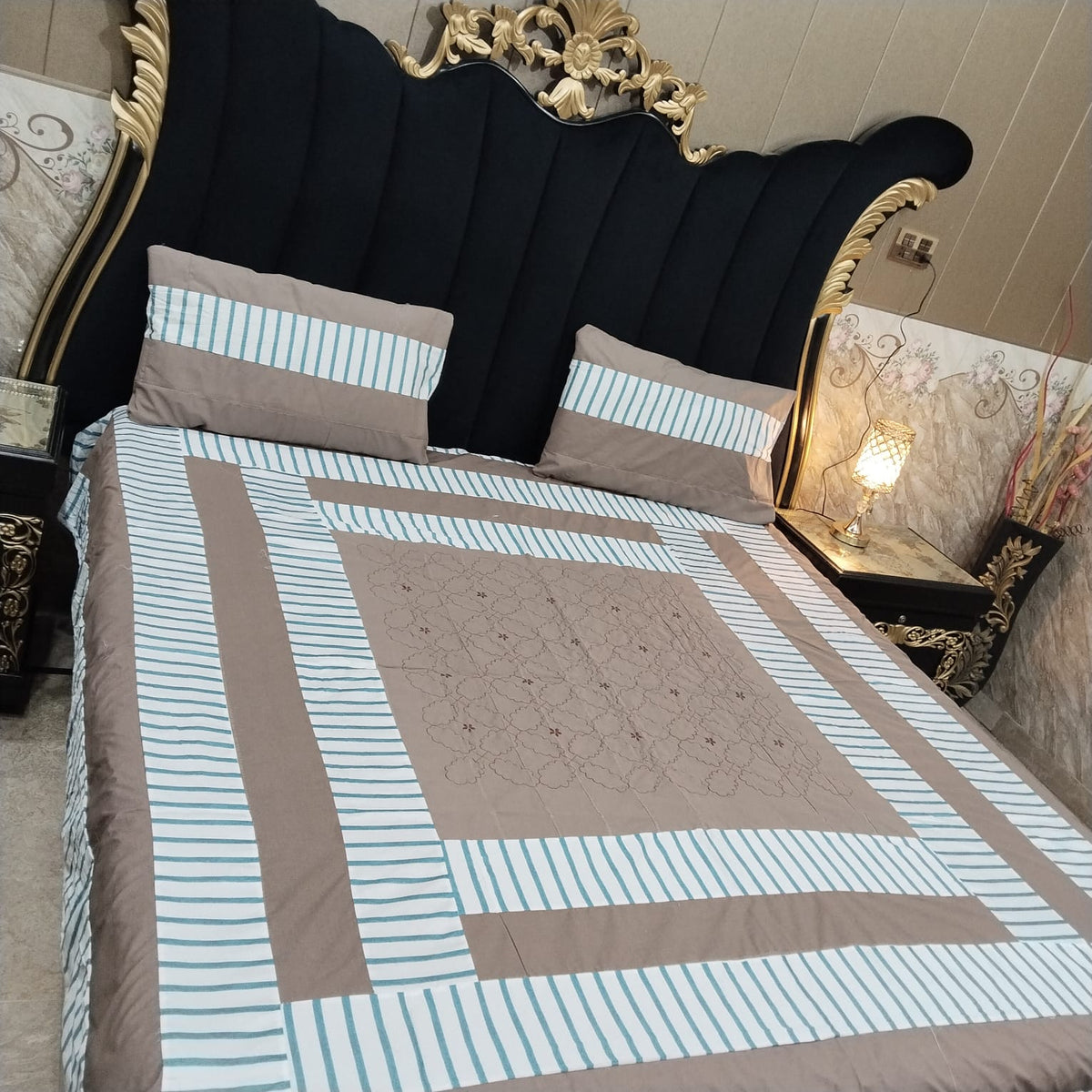 Colorful embroidered patchwork bedsheet by Al Ghani O Nisar featuring intricate stitching and vibrant patterns.