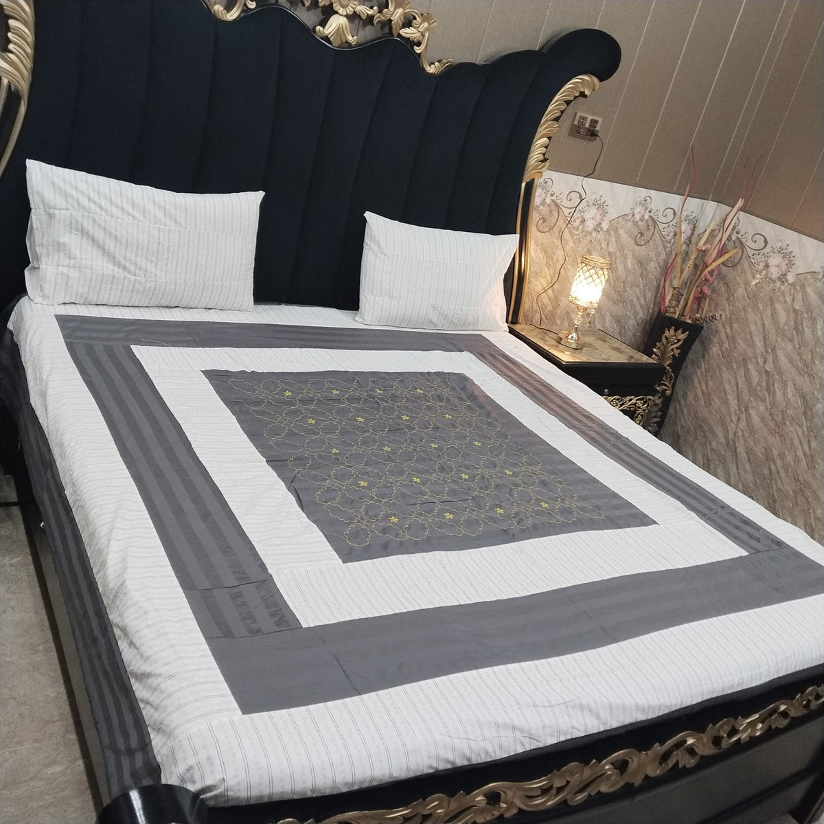 Al Ghani O Nisar embroidered patchwork bedsheet with colorful intricate patterns and detailed stitching on soft fabric.