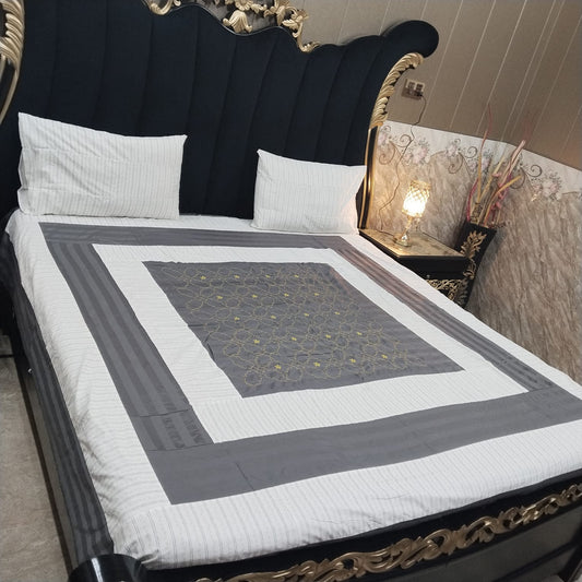 Al Ghani O Nisar embroidered patchwork bedsheet with colorful intricate patterns and detailed stitching on soft fabric.