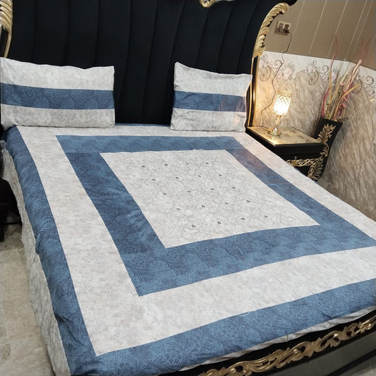 Colorful embroidered patchwork bedsheet by Al Ghani O Nisar, showcasing intricate stitching and vibrant fabric patterns.