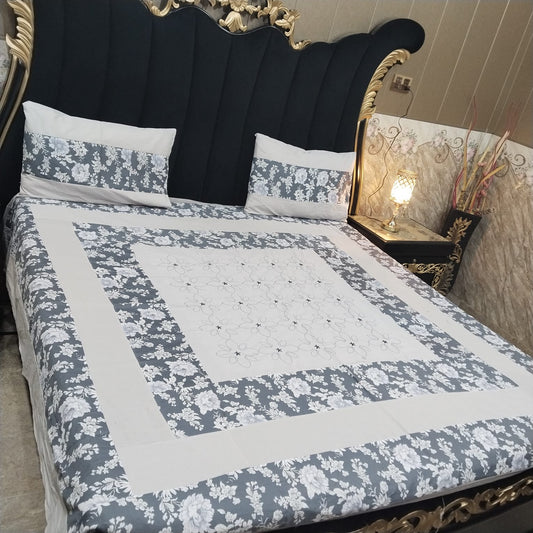 Colorful embroidered patchwork bedsheet by Al Ghani O Nisar featuring intricate patterns and vibrant design for a cozy bedroom look.