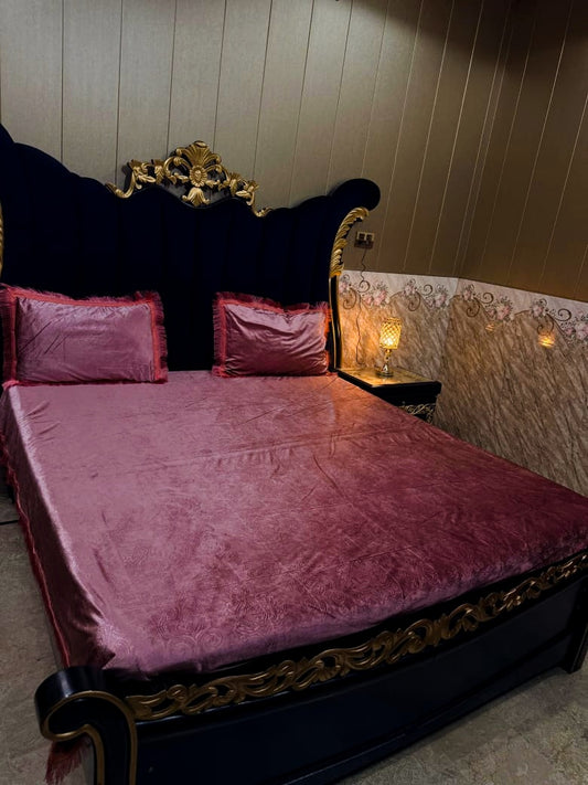 Al Ghani O Nisar embossed velvet bedsheet in rich fabric with intricate patterns, displayed on a neatly made bed.